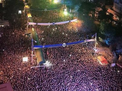 kosovans standing downtown during 10 years celebration