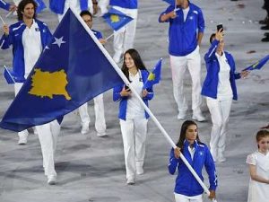 majlinda kelmendi waves flag at olympic ceremony