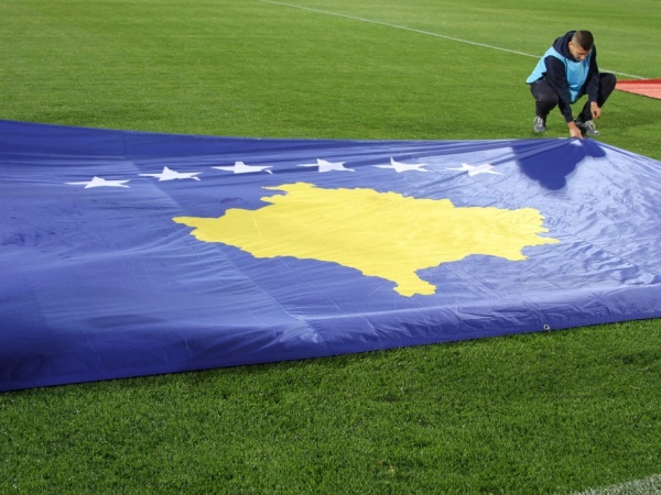 kosovan flag on football pitch