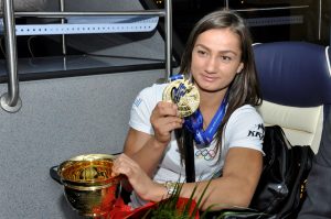 kosovo judo player Majlinda Kelmendi with gold medal